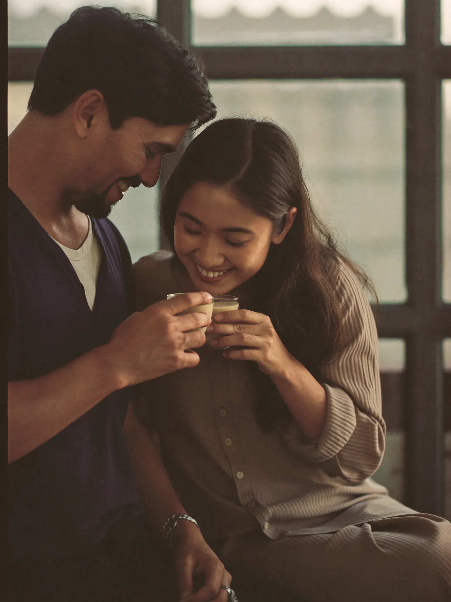 A young Nepali couple sharing chiya